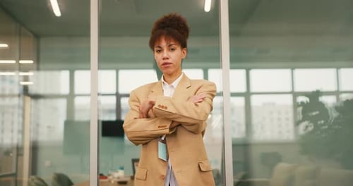 Confident Young Professional Woman Smiling in Office