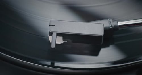 Vinyl Record Rotating On Retro Turntable Stylus Needle Touching Grooves Playing Sound