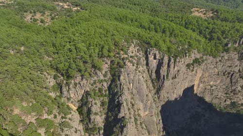 Aerial View Two Girls Pose at the Edge of a Canyon Capturing the Beauty of Turkey