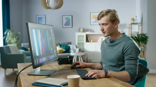 Professional Photographer Works in Photo Editing App / Software on His Personal Computer. Photo Edi