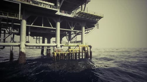Offshore Oil Rig Platform Amidst Dark Choppy Ocean Waves