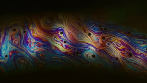 Abstract colorful swirling pattern with dark background