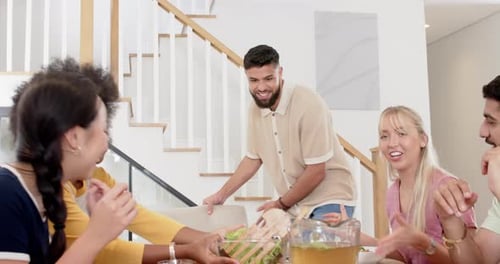 Friends Enjoying Meal Together at Home