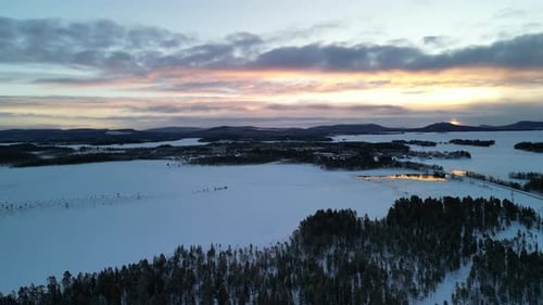Aerial view of winter landscapes with snow-covered forest in Finland