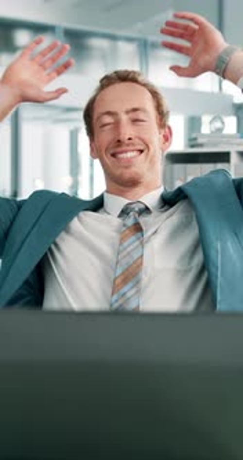 Man, office and relief by laptop, smile and relax for complete project for deadline at financial
