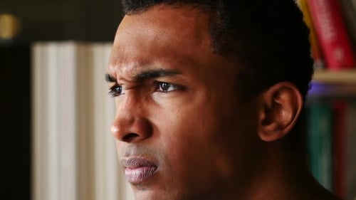 Angry Disappointed AfroAmerican Man Face Close Up Side View