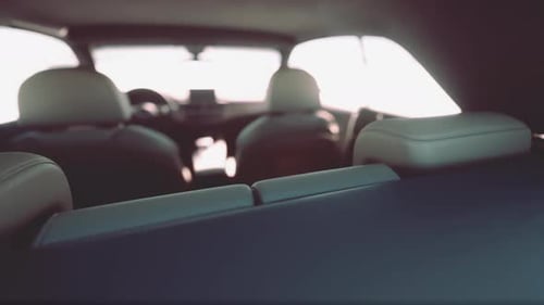 Modern Car Interior View from Back Seat Driving