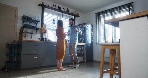 Couple Chatting in Bright and Modern Kitchen