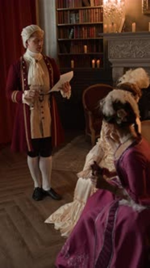 People in Period Costumes in Elegant Home