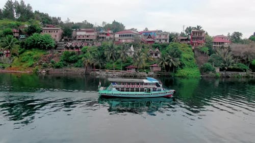 A Ferry on the clear waters of Lake Toba, Sumatra.