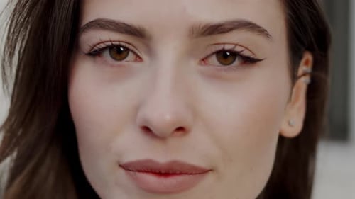CloseUp Portrait of a Young Woman with Mesmerizing Hazel Eyes