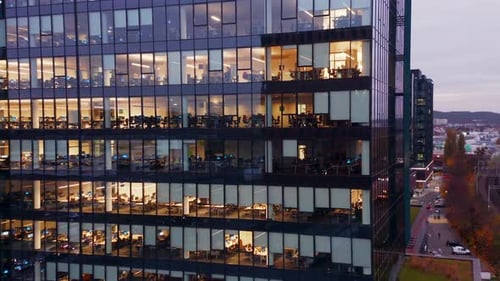 Cinematic Shot of Corporate Office Buildings Skyscrapers Illuminated at Night