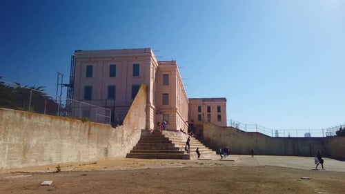 Gimbal wide panning shot of the Recreation Yard at Alcatraz Federal Prison in San Francisco, Califor