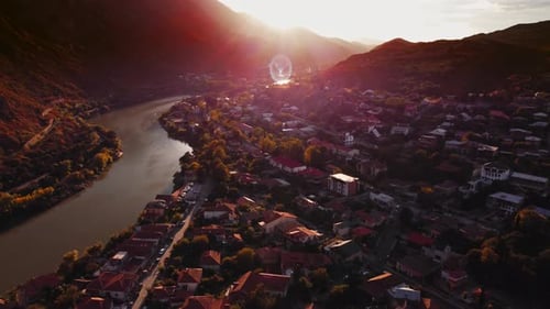 Drone Townscape of Mtskheta Located on the Shore of Mountain River Filmed at the Dusk