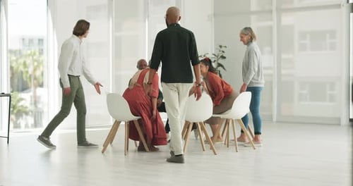 Men, woman and group in circle for counselling with mental health, support and psychology in office