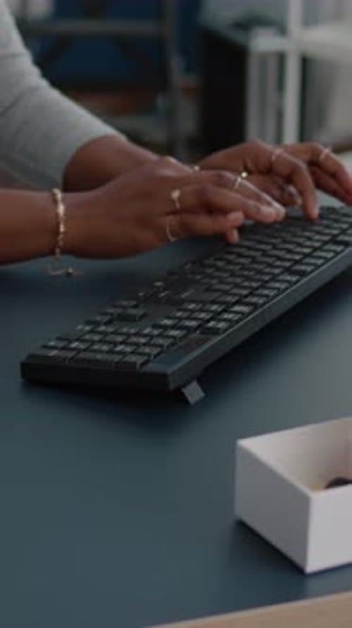 Vertical Video Closeup of Student with Black Skin Hands Typing on Keyboard Searching Information