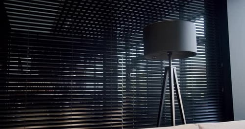 Lamp Near Window With Modern Blinds