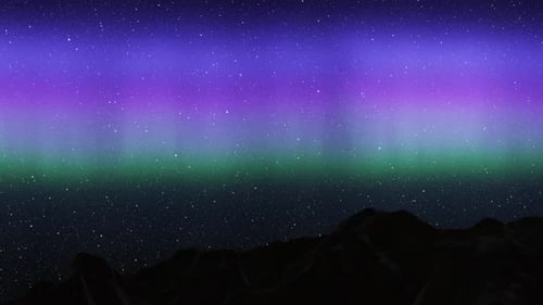 Colored aurora borealis northern lights behind mountains
