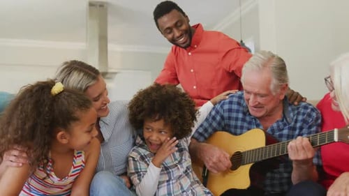 Family Plays Guitar Together in their Home