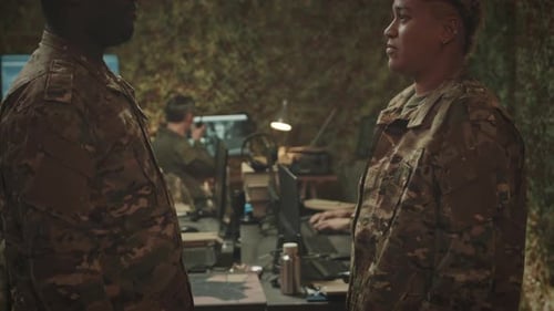 Military Control Center Officers Shaking Hands in Agreement