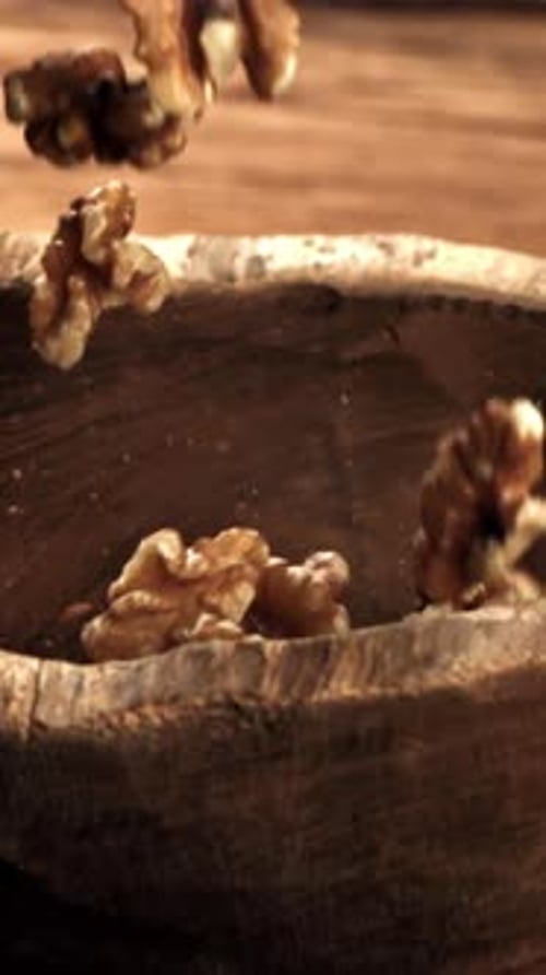 Walnuts Fall Into a Wooden Bowl Filmed on a Highspeed Camera at 1000 Fps