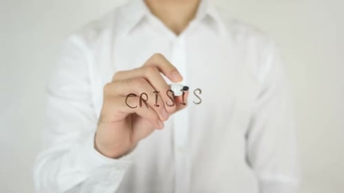 Writing Crisis With Marker on Clear Surface