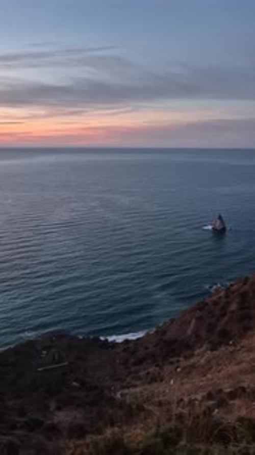 Cliff Ocean Sunset Tranquil Coastal Landscape at Dusk Dramatic View From Above Serene Natural Beauty