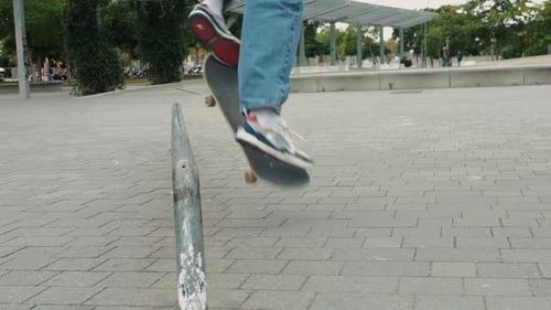 Skateboarder Performs Trick on Metal Rail in Park