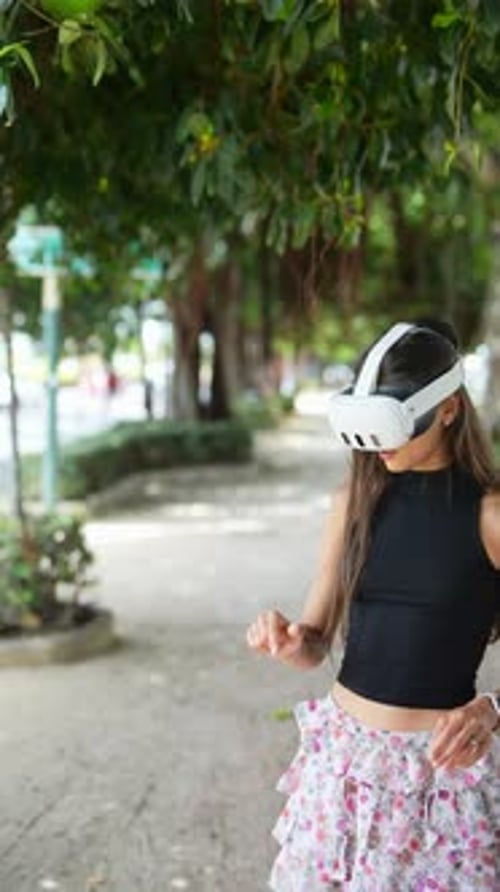 Woman Uses VR Headset in Park