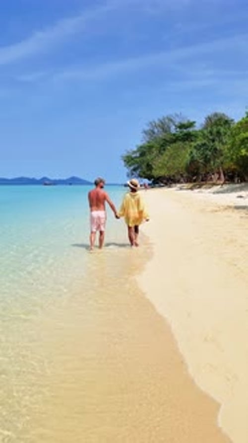 Couple Strolling Along Beach Hand in Hand Beneath the Cloudy Sky Koh Kradan Thailand