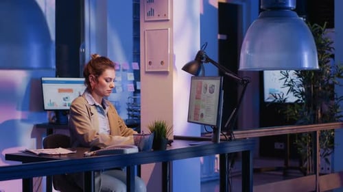 Tired Employee Standing Up Streching Body in Office