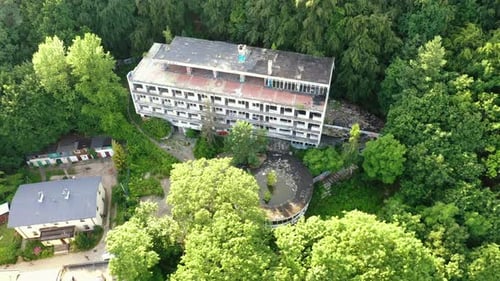 Aerial shot of drone flying above the old abandoned hotel in Gdynia