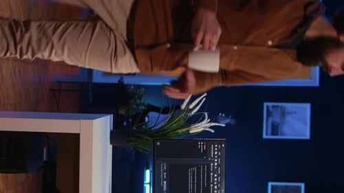 IT Specialist Begins Teleworking Job Shift Holding Cup of Tea