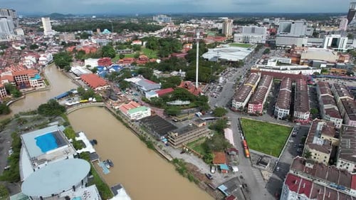 Aerial drone of a river in the city of Malacca Malaysia during lock track left shot