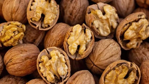 Close up of fresh walnuts with and without shells