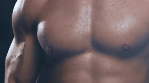 Fit and Sporty Bodybuilder Over Black Background Bodybuilder Training Using Barbell The Concept of
