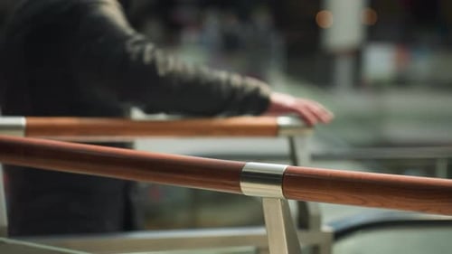 Busy Mall Scene with Blurred Background and Handrails FirstPerson View