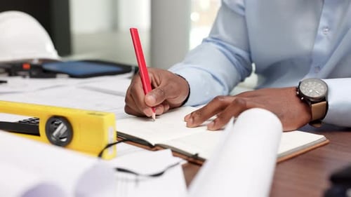 Notes, writing and construction work ideas at the desk in the office