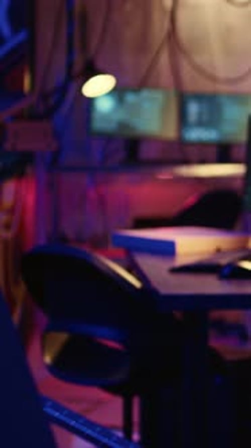 Illuminated Computer Screens in Dim Room at Night