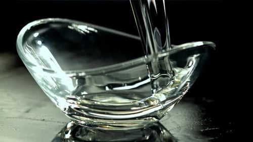 Clear Liquid Poured Into Elegant Glass Bowl