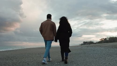 Happy Couple Enjoy Valentines Day on the Beach at Sunset