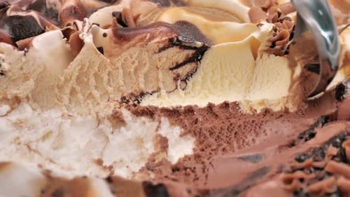 Close Up Move the Camera Vanilla Ice Cream Scooped Out From Container with a Spoon