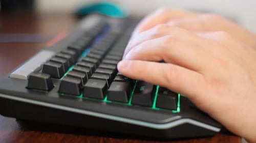 Typing on Computer Keyboard Hand of Software Programmer IT Support
