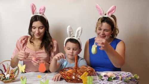 Family Decorating Easter Eggs at Home