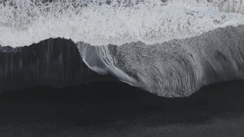 Aerial view of a black sand beach in Iceland.