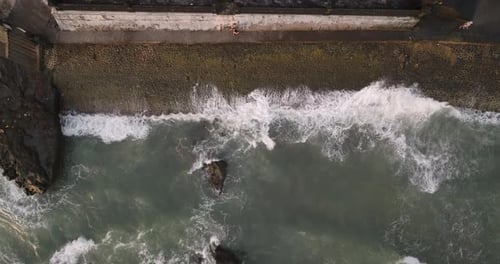 High-angle view of waves reaching the waterfront in Bali, Indonesia