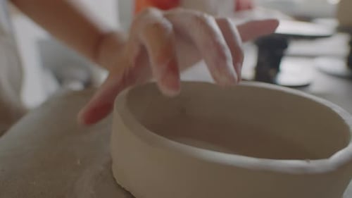 Hands Forming Clay Pottery Bowl