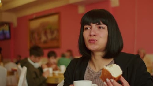 Woman in Cafe Sipping Coffee and Eating Cupcake Casual Dining Experience Coffee Break and Leisure