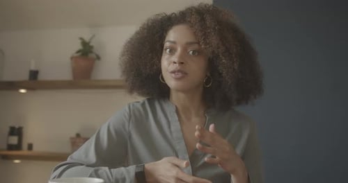 Woman Speaking to Camera in Indoor Setting