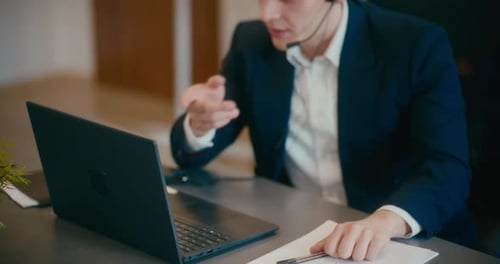 Manager Discussing on Video Call in Office